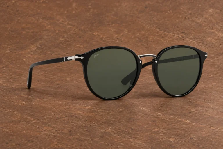 Persol PO3210S sunglasses on a warm brown editorial background